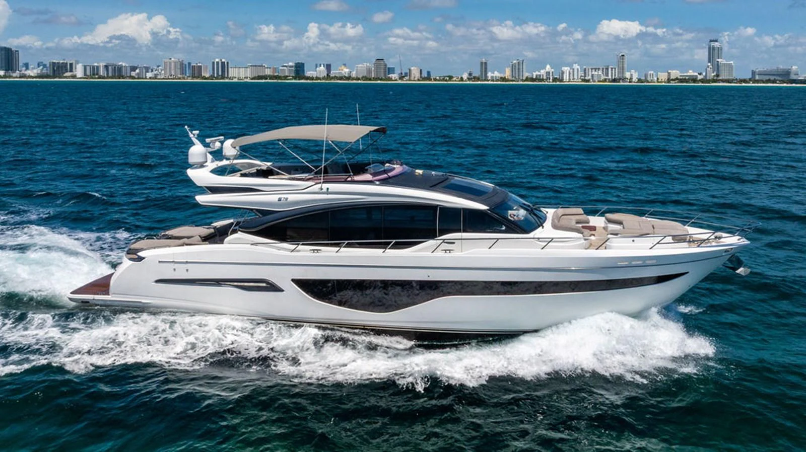 a white boat on the water aboard COCOON Yacht for Sale