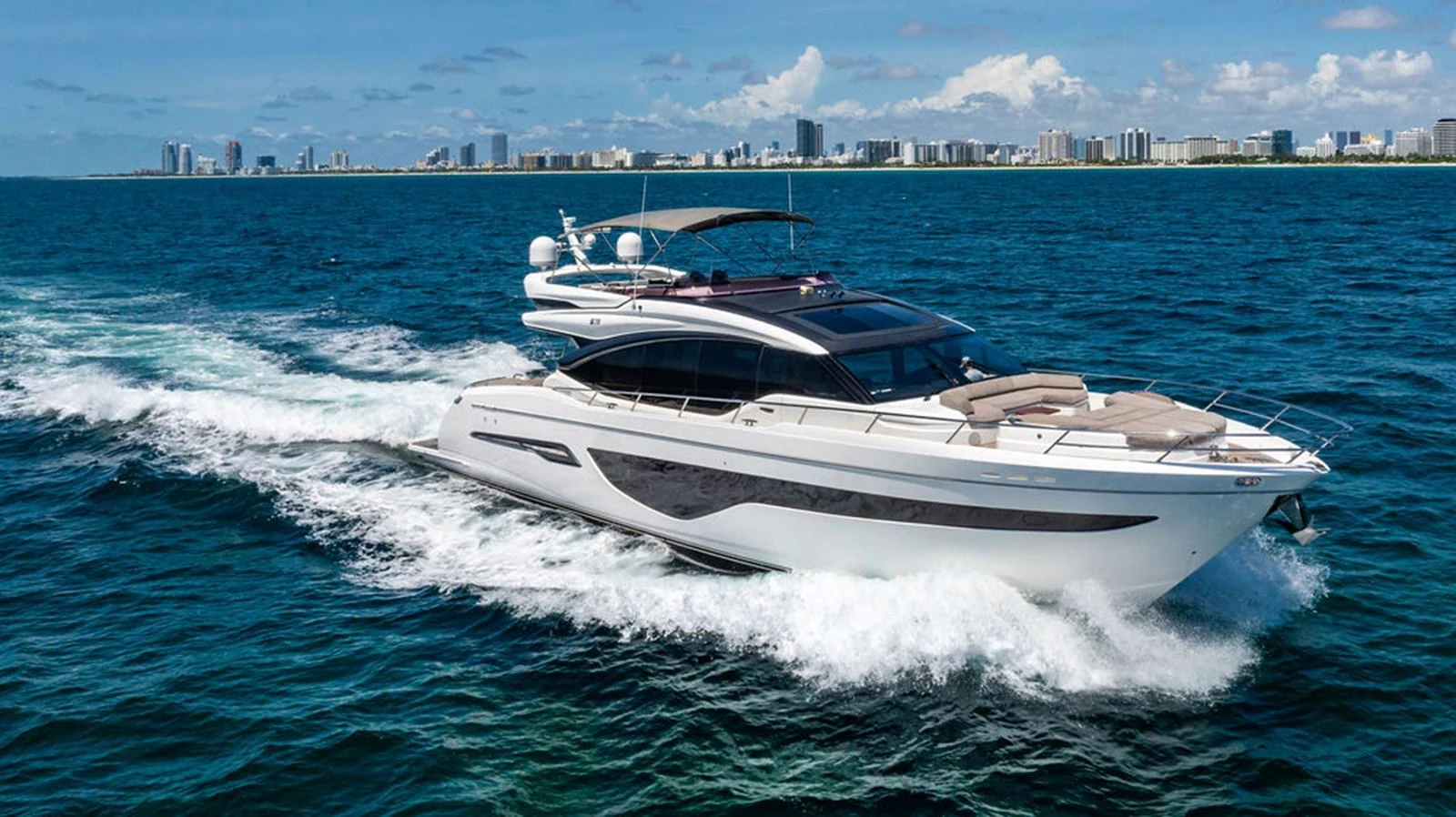 a white boat on the water aboard COCOON Yacht for Sale