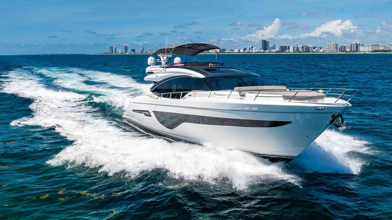 a white yacht on the water aboard COCOON Yacht for Sale