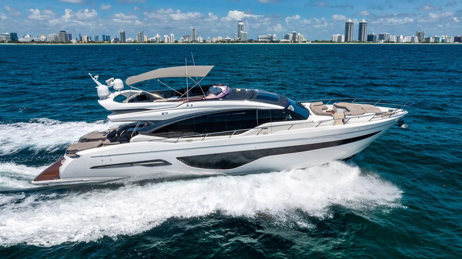 a white yacht on the water aboard COCOON Yacht for Sale