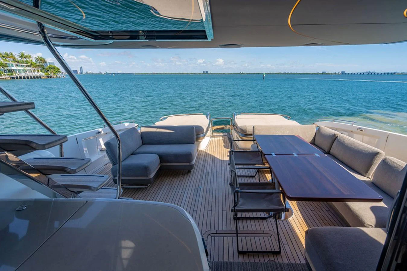 a deck with chairs and a pool aboard COCOON Yacht for Sale