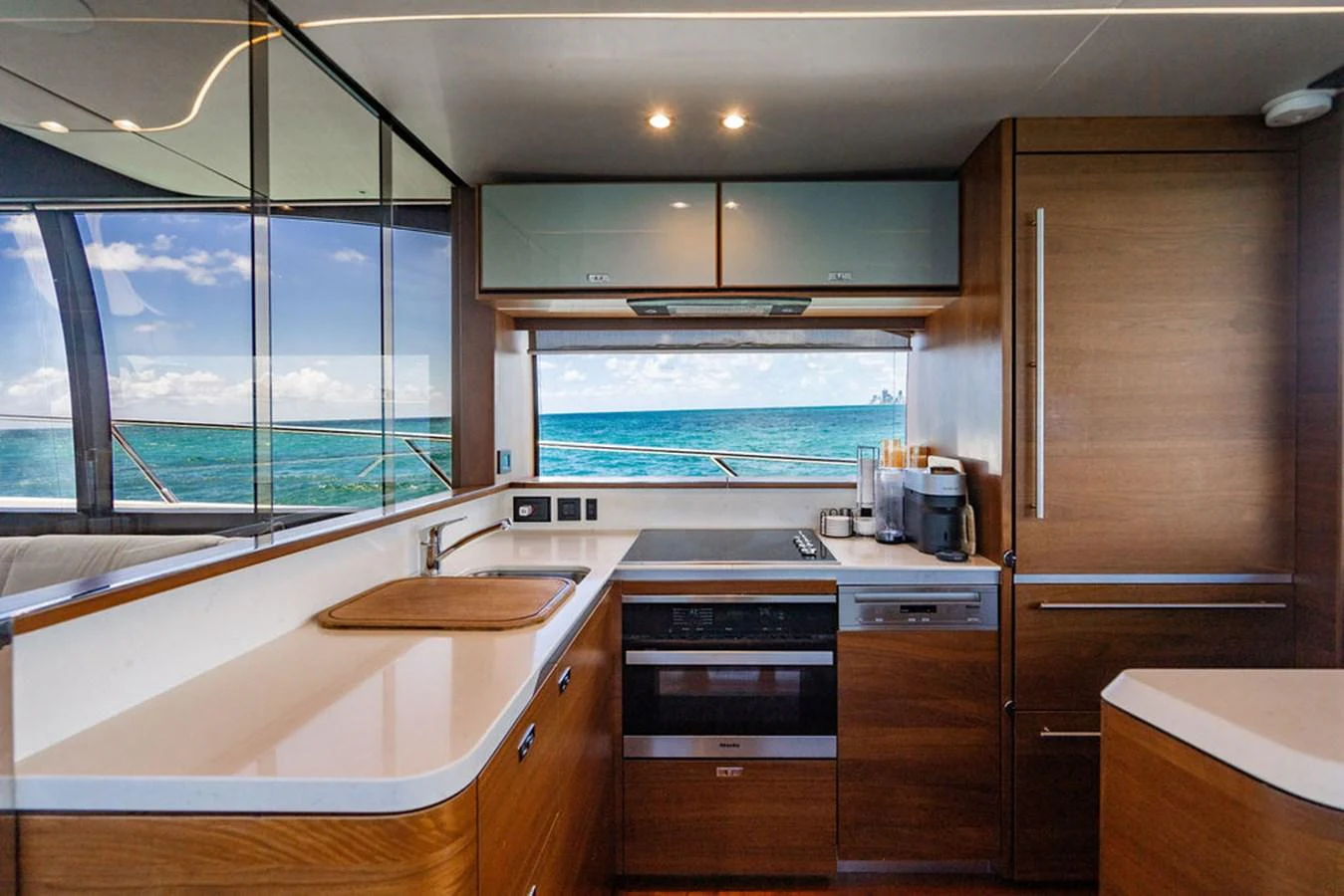 a kitchen with a large window aboard COCOON Yacht for Sale