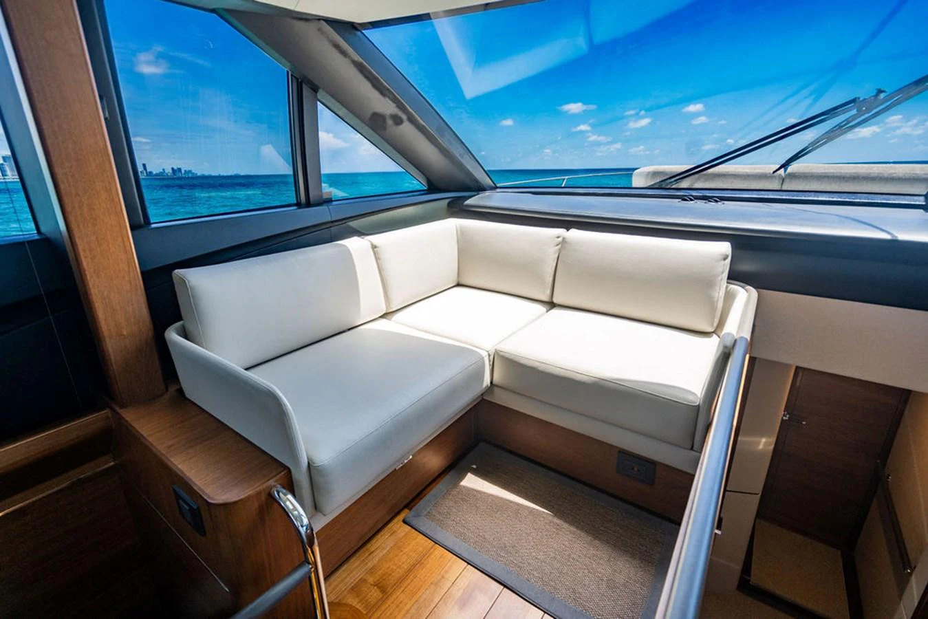 a white couch in a car aboard COCOON Yacht for Sale