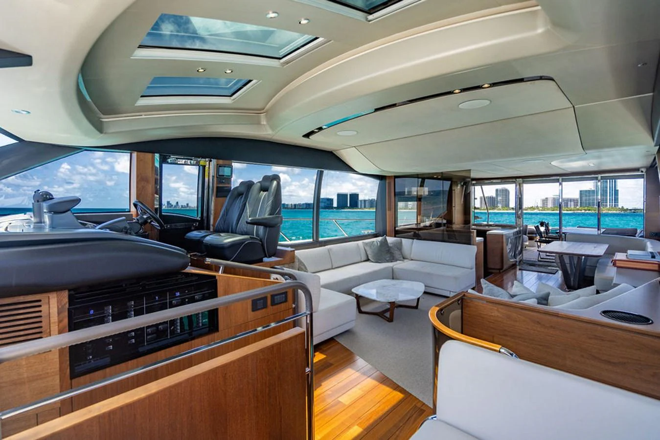 inside of a vehicle with a piano and a large window aboard COCOON Yacht for Sale