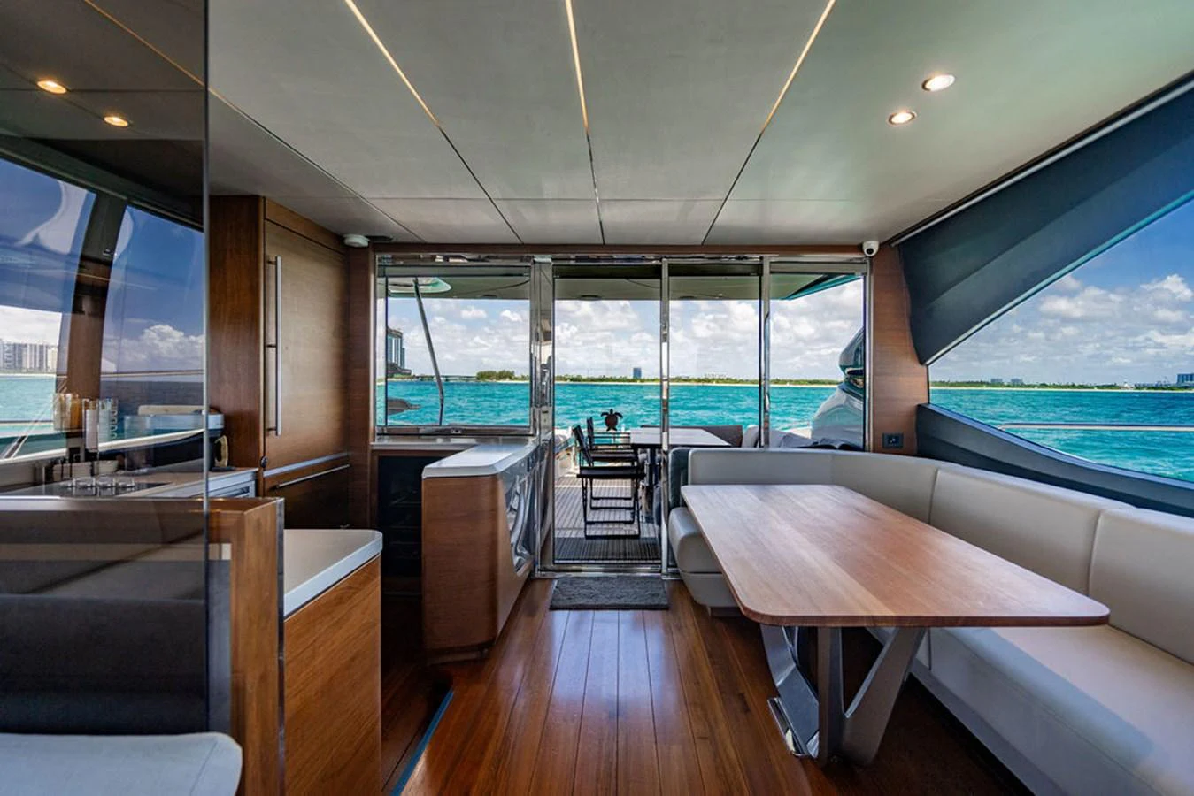 a room with a table and chairs aboard COCOON Yacht for Sale