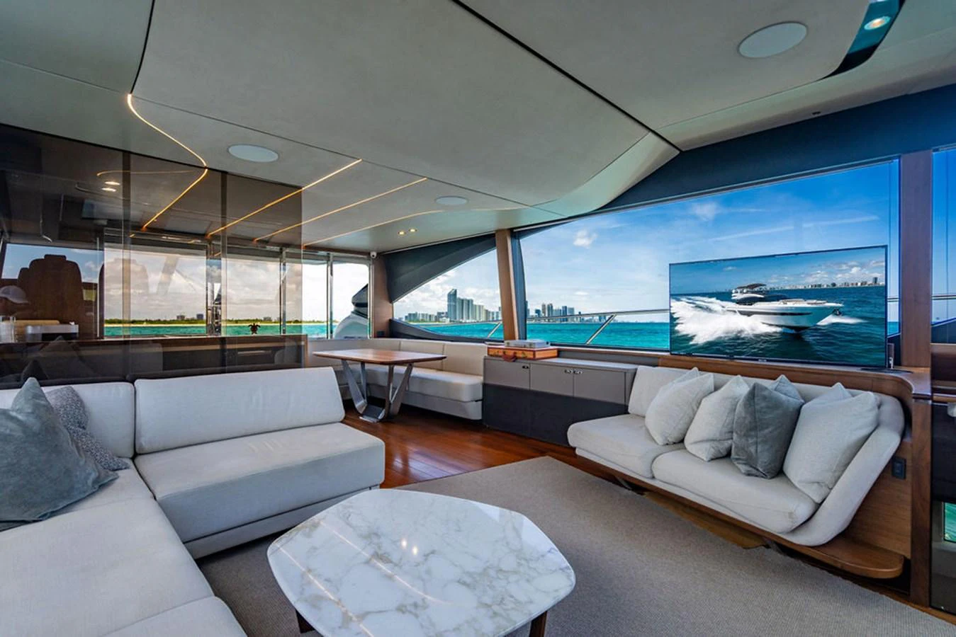 a living room with a large glass window aboard COCOON Yacht for Sale