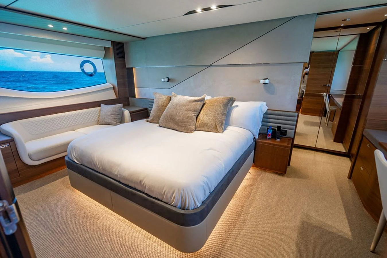 a room with a bed and a window aboard COCOON Yacht for Sale