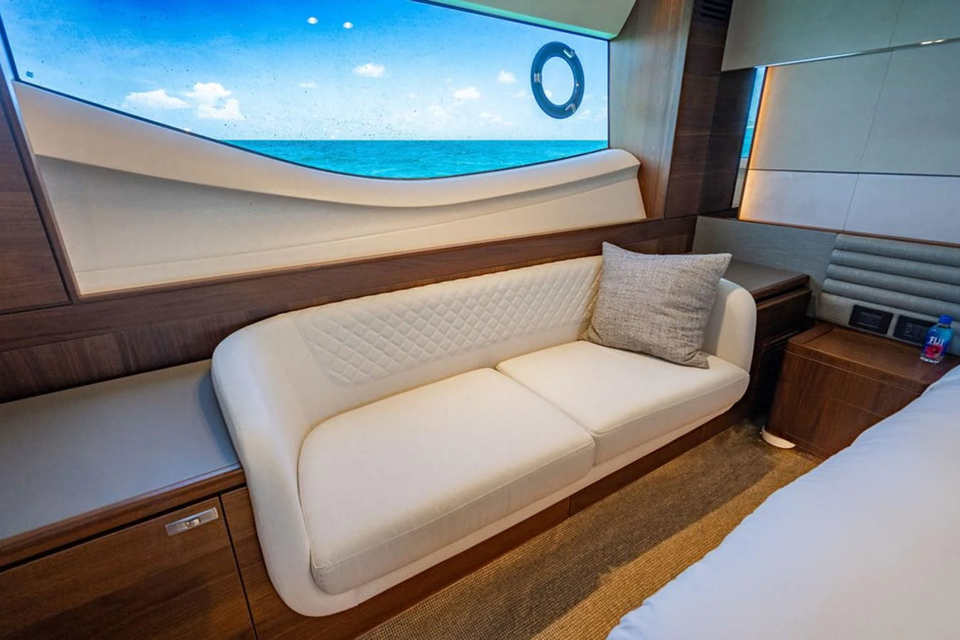 a bed with a large blue screen aboard COCOON Yacht for Sale