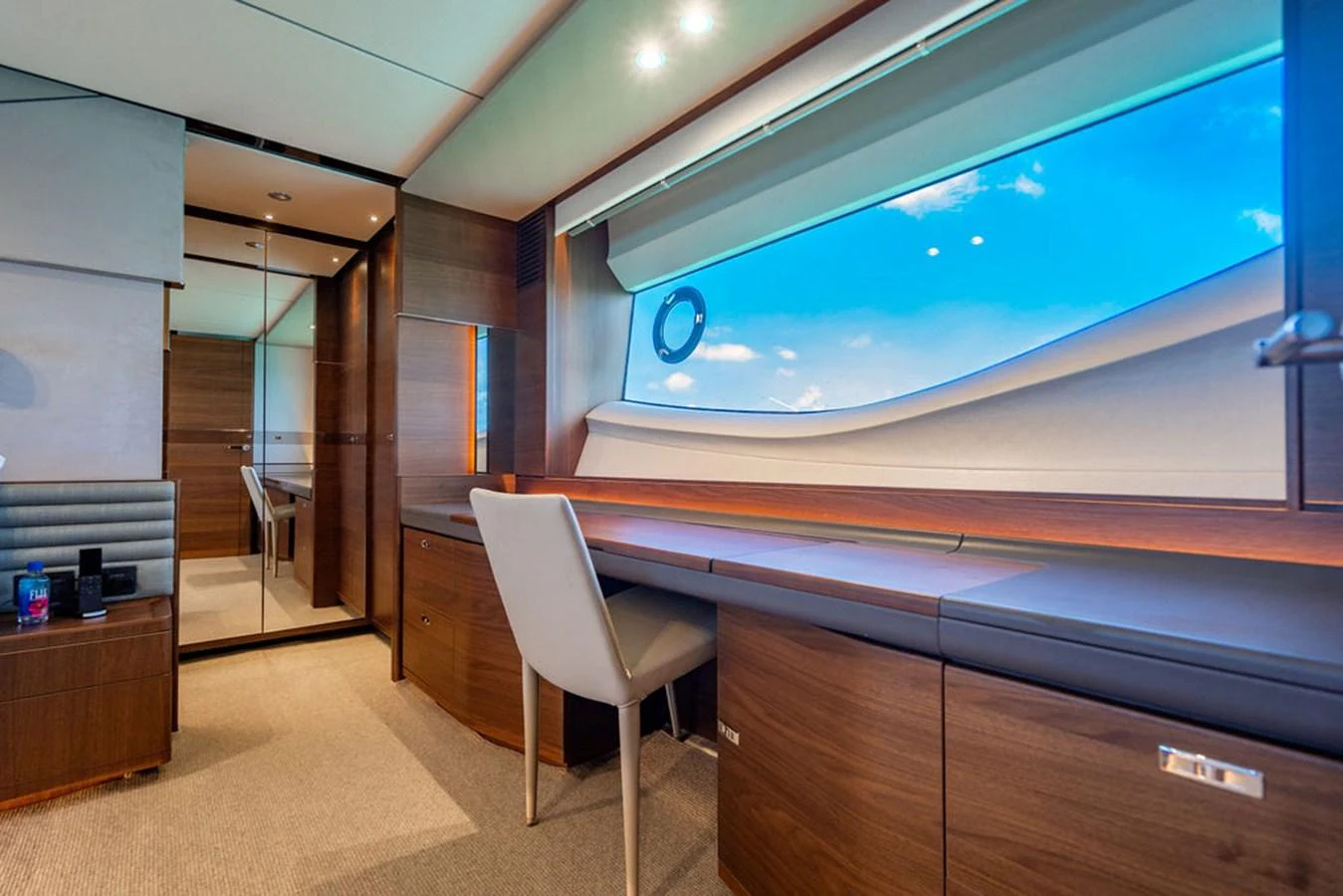 a room with a chair and a large screen aboard COCOON Yacht for Sale