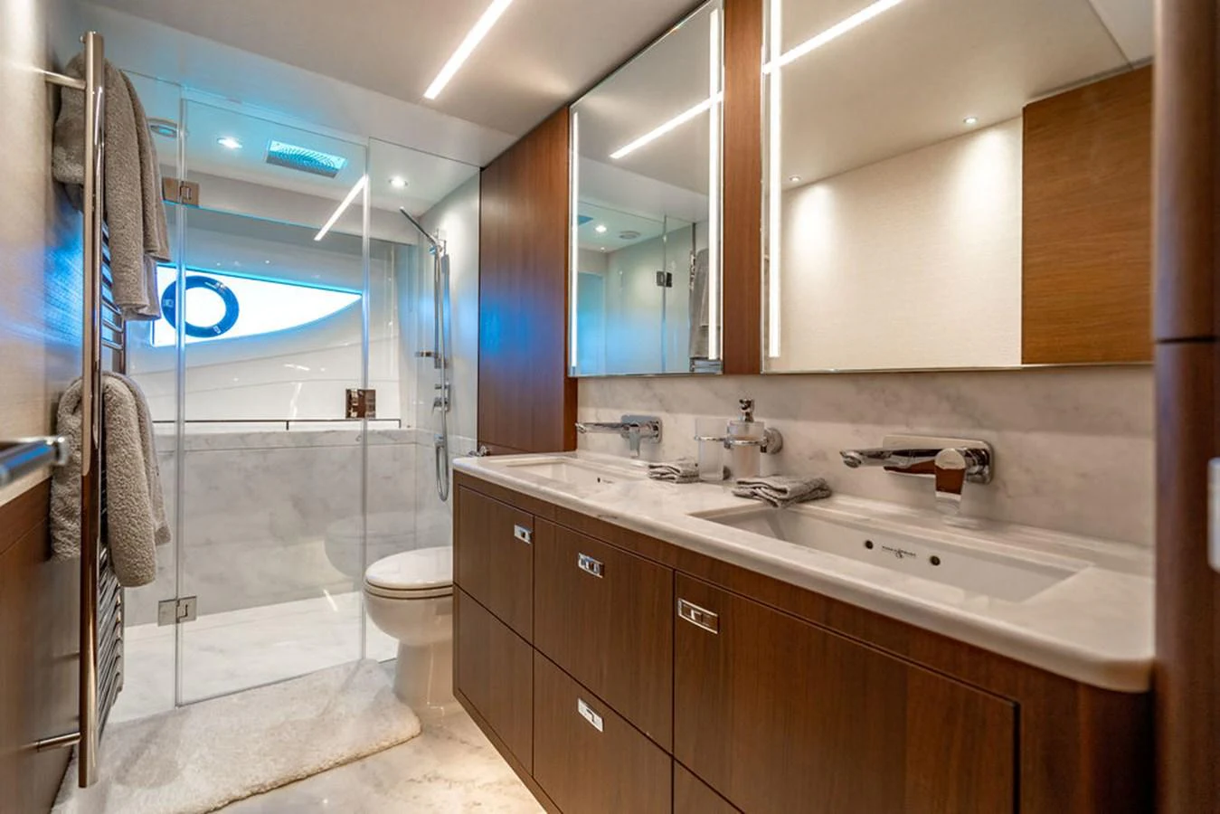 a bathroom with a glass shower aboard COCOON Yacht for Sale