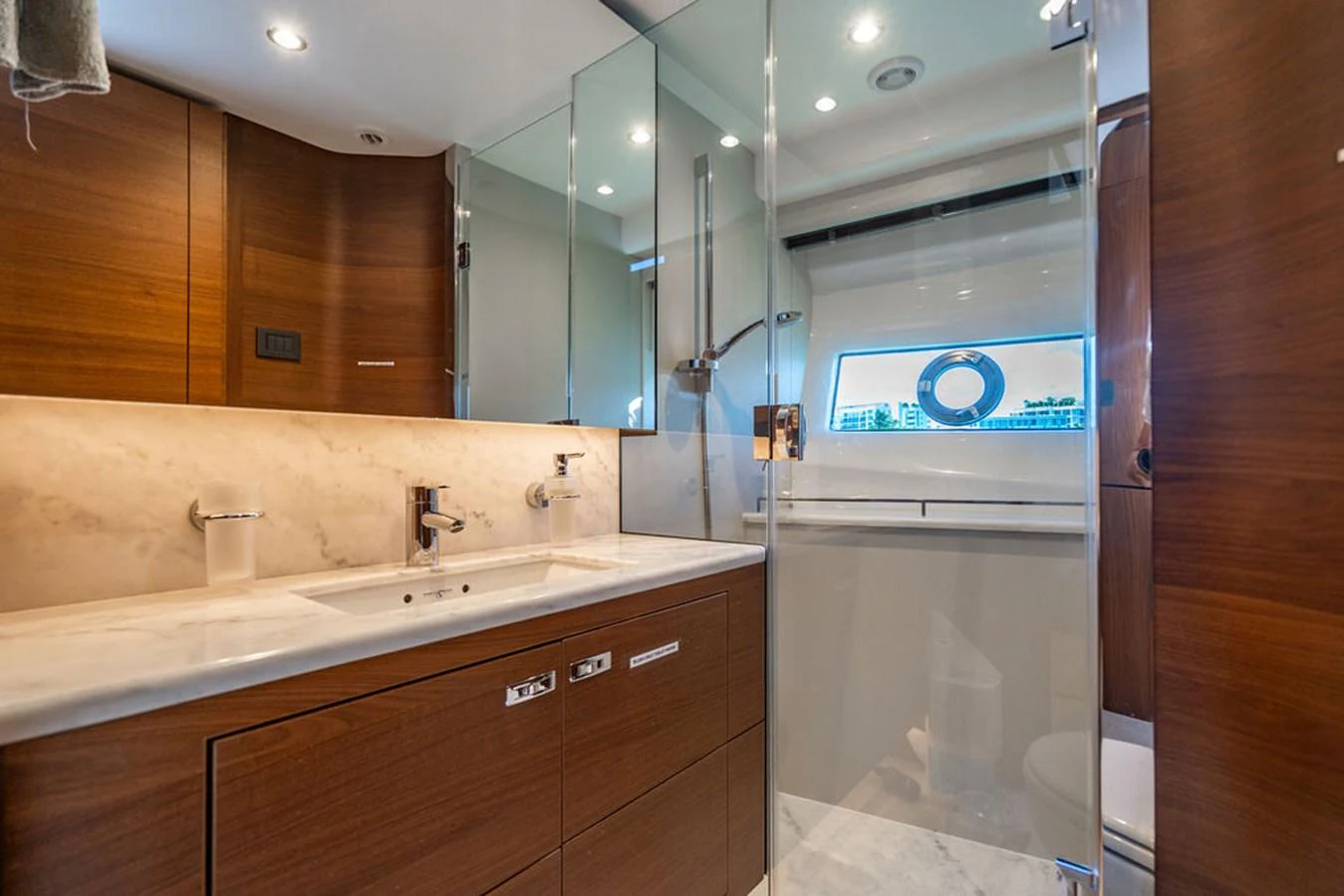 a bathroom with a large mirror aboard COCOON Yacht for Sale