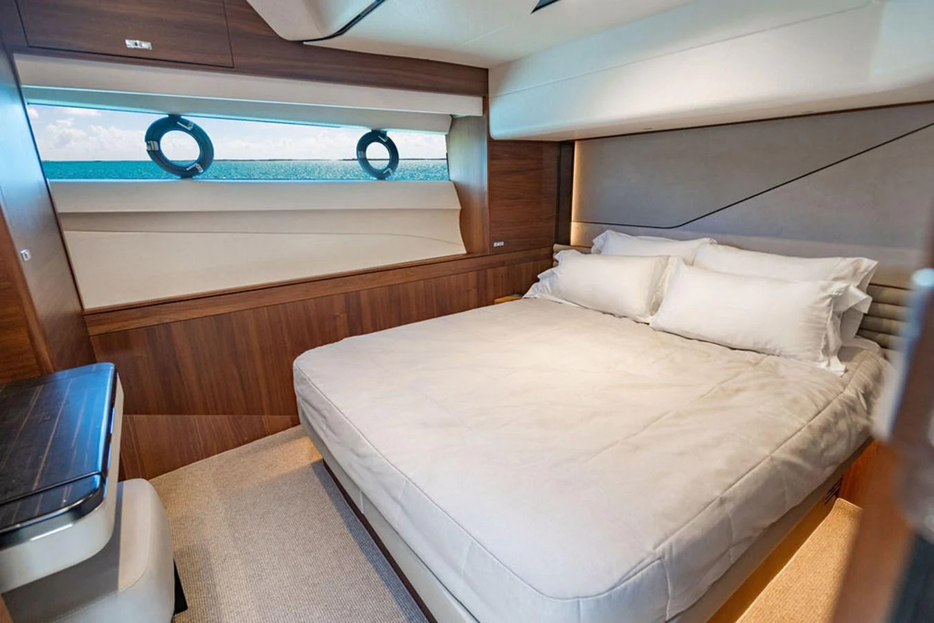 a bed with a white sheet aboard COCOON Yacht for Sale
