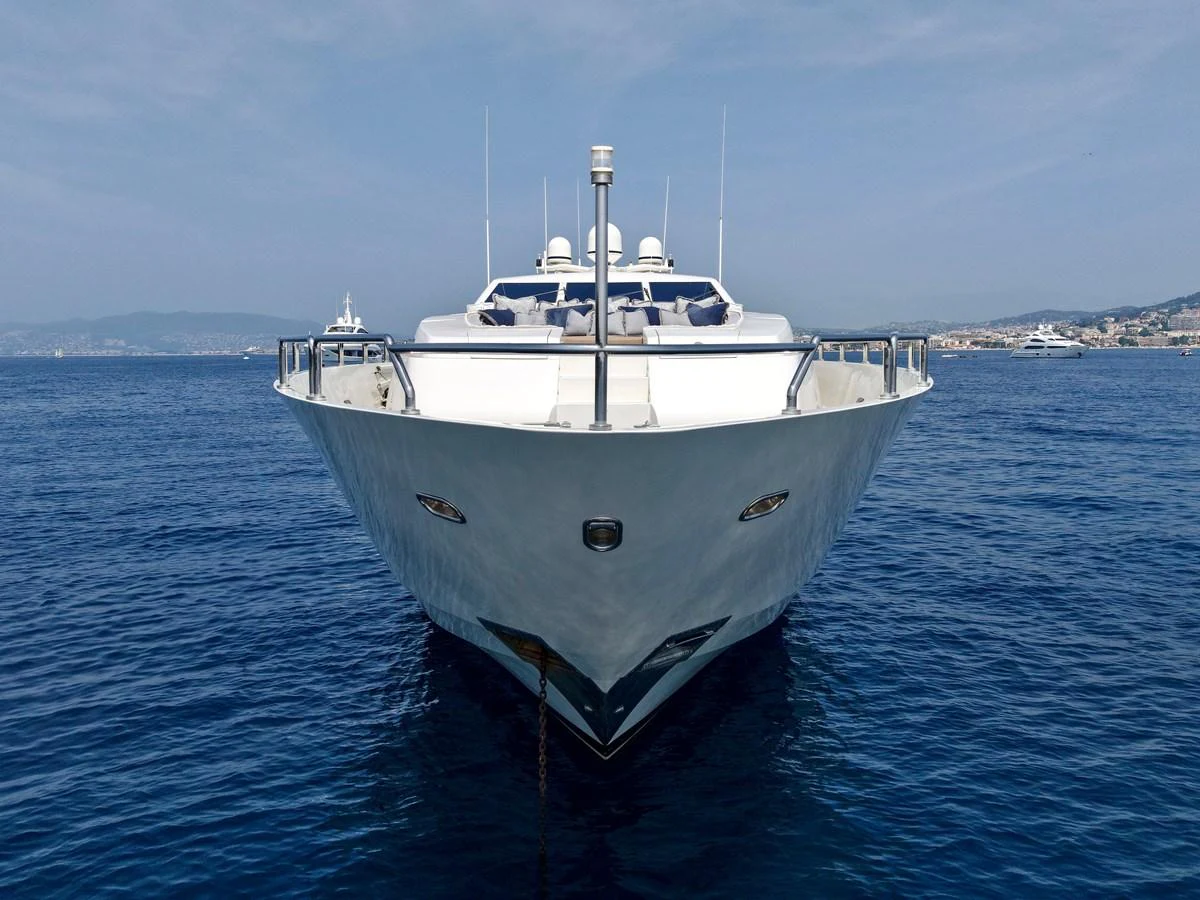 A stunning yacht is captured head-on, showcasing its sleek design and presence on the water. aboard CHEEKY TIGER Yacht for Sale