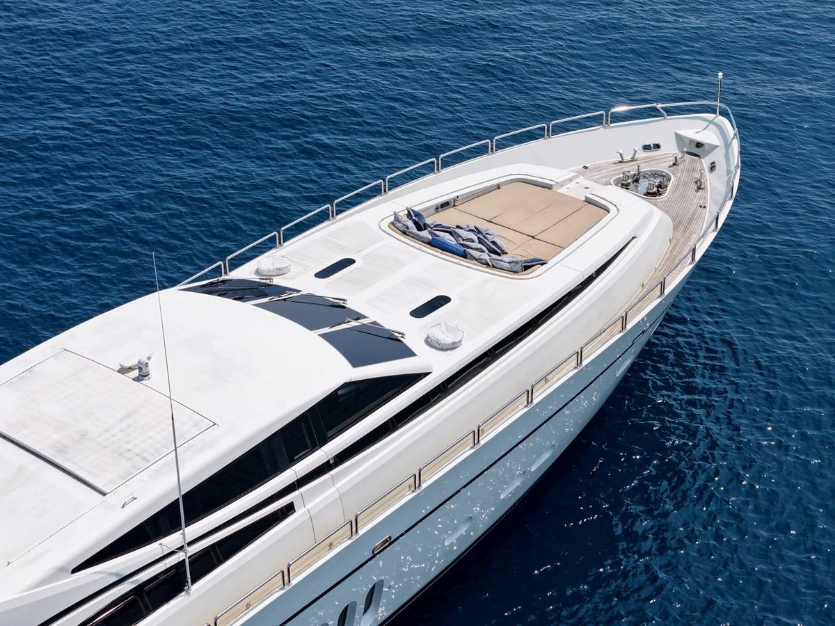 A sleek and modern yacht glides gracefully on the open water, showcasing its elegant design and spacious deck. aboard CHEEKY TIGER Yacht for Sale