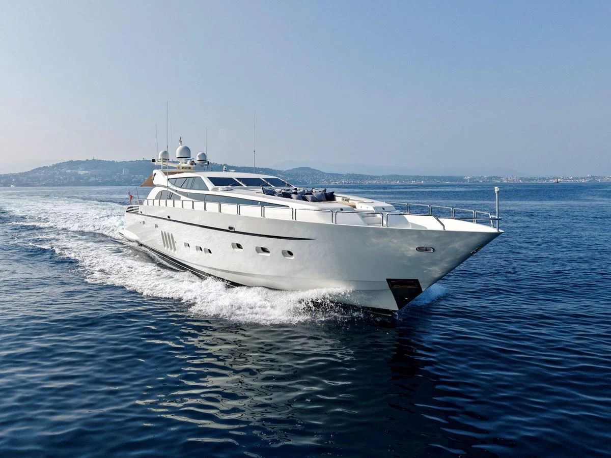 A sleek and modern yacht glides effortlessly through the calm blue waters. aboard CHEEKY TIGER Yacht for Sale