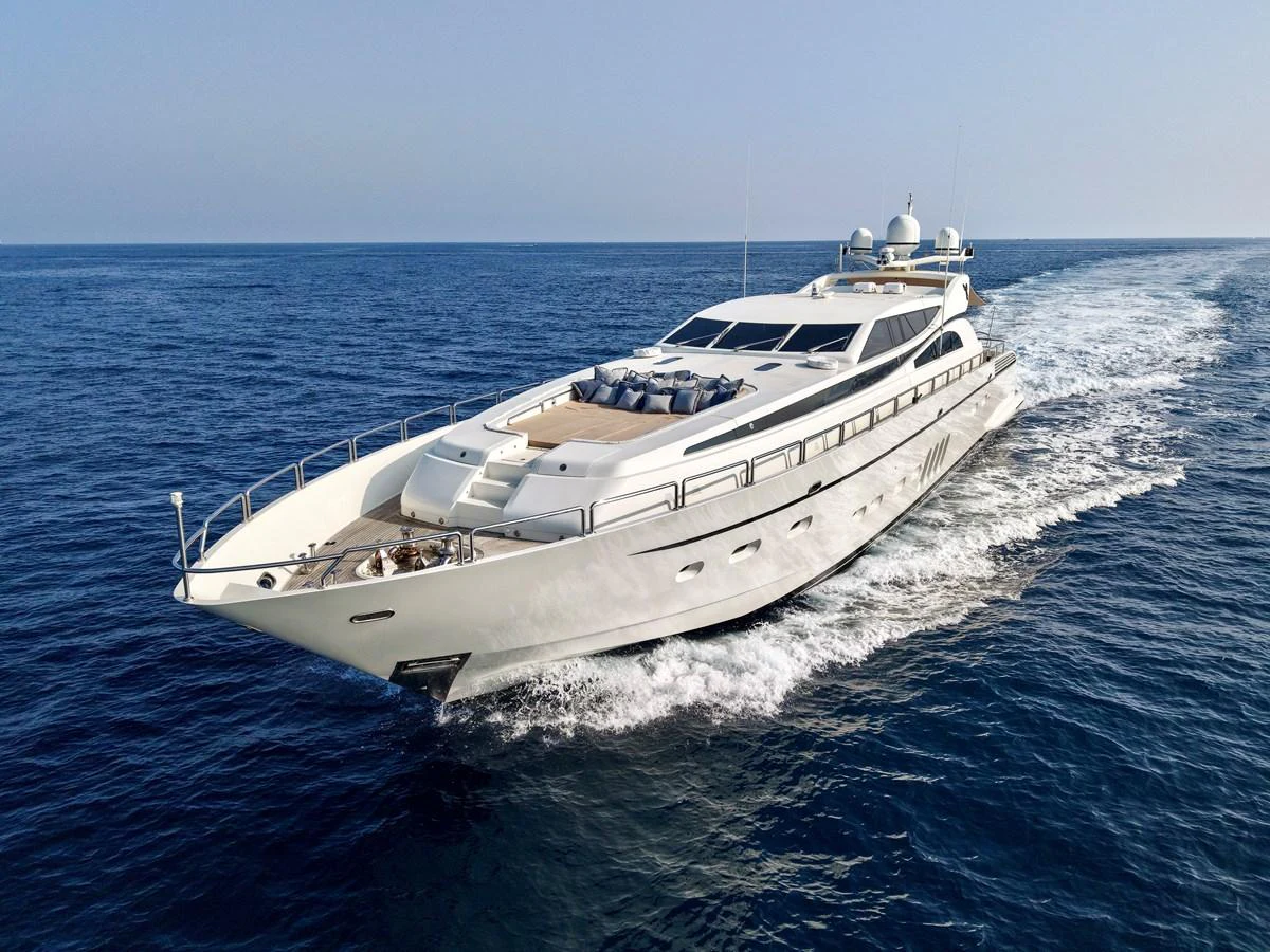 A sleek, modern yacht cruises swiftly through the open sea, showcasing its elegant design and luxurious amenities. aboard CHEEKY TIGER Yacht for Sale
