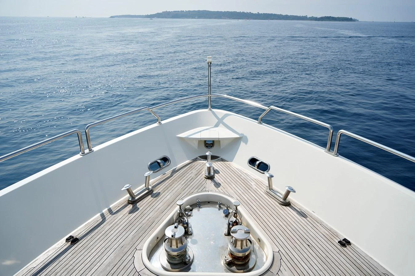 The bow of the yacht showcases a sleek and polished deck with a stunning view of the open sea. aboard CHEEKY TIGER Yacht for Sale