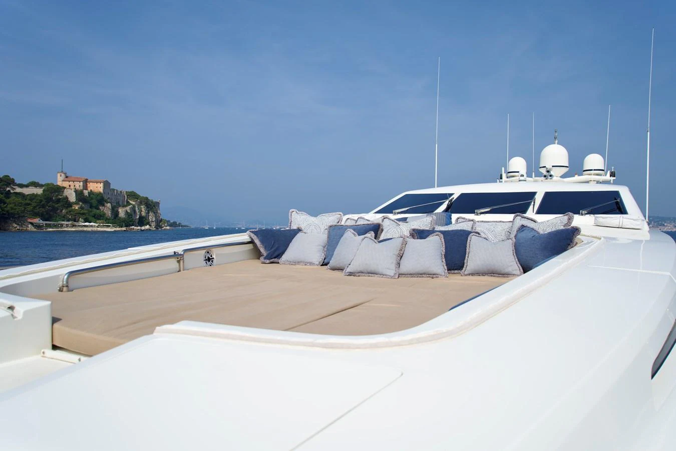 The yacht's foredeck features a spacious sunbathing area with plush cushions, perfect for relaxation. aboard CHEEKY TIGER Yacht for Sale