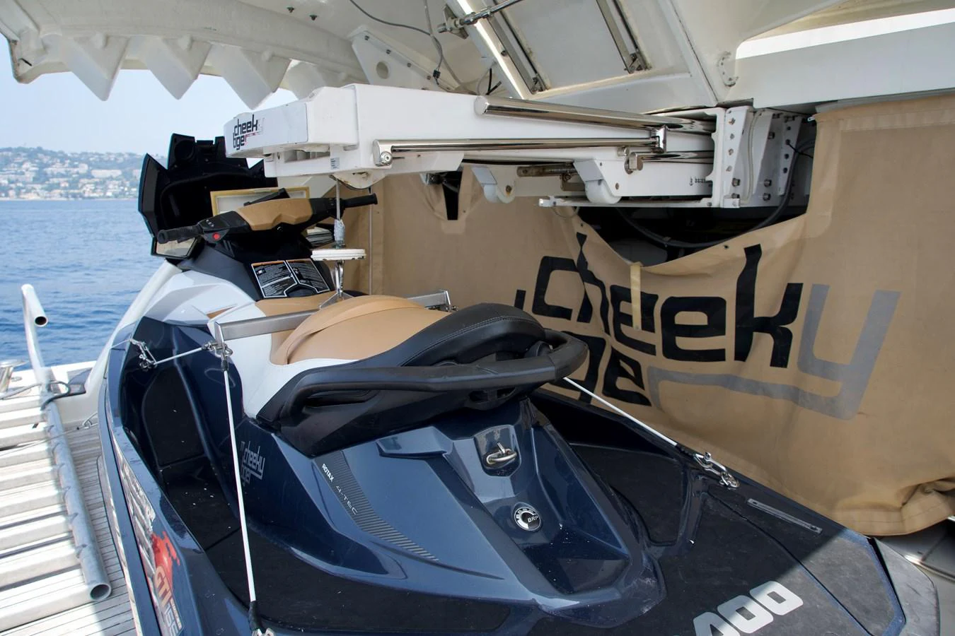 A sleek personal watercraft is stored on the yacht, ready for adventure. aboard CHEEKY TIGER Yacht for Sale