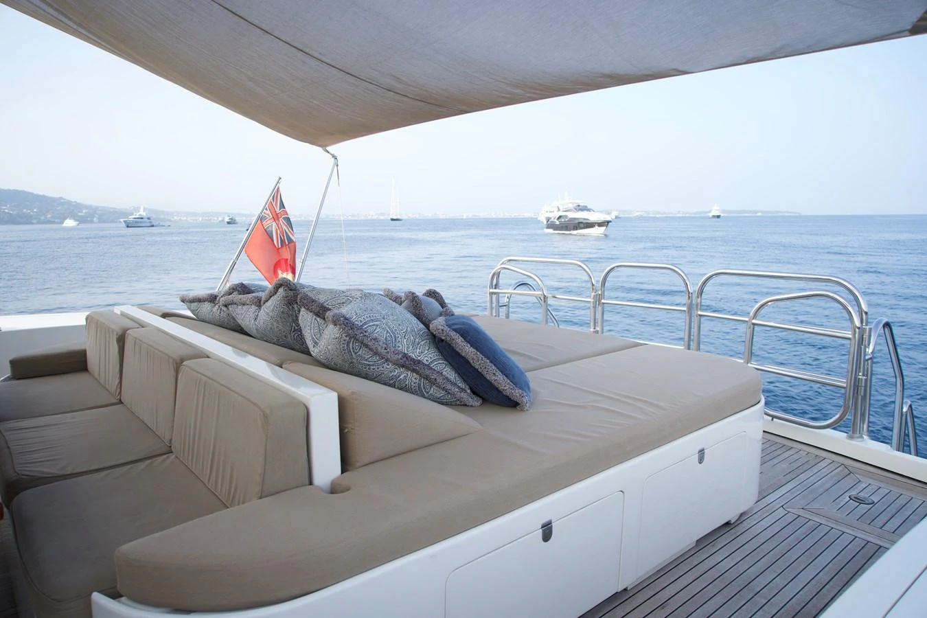 The aft deck offers a spacious lounging area with comfortable seating and a scenic view of the sea. aboard CHEEKY TIGER Yacht for Sale