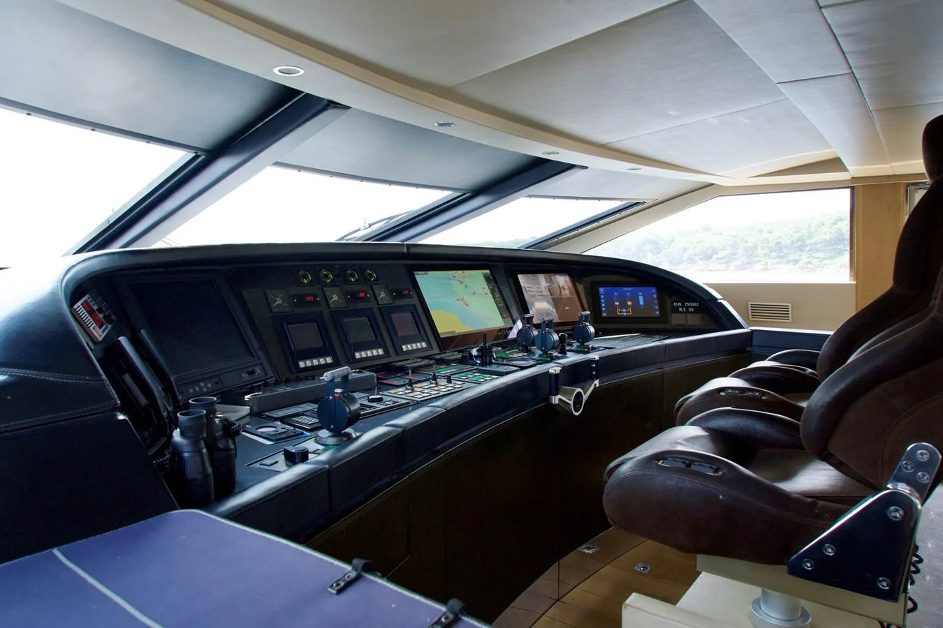 The helm station features advanced navigation equipment and luxurious seating. aboard CHEEKY TIGER Yacht for Sale