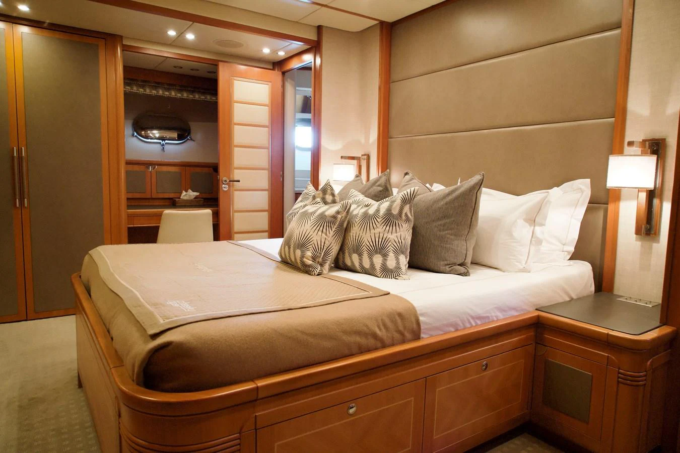 The stateroom features a plush bed with elegant bedding and ample storage space, creating a cozy and luxurious retreat. aboard CHEEKY TIGER Yacht for Sale