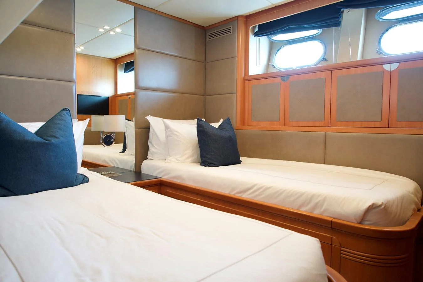 The twin stateroom offers a cozy and comfortable sleeping area with elegant finishes. aboard CHEEKY TIGER Yacht for Sale