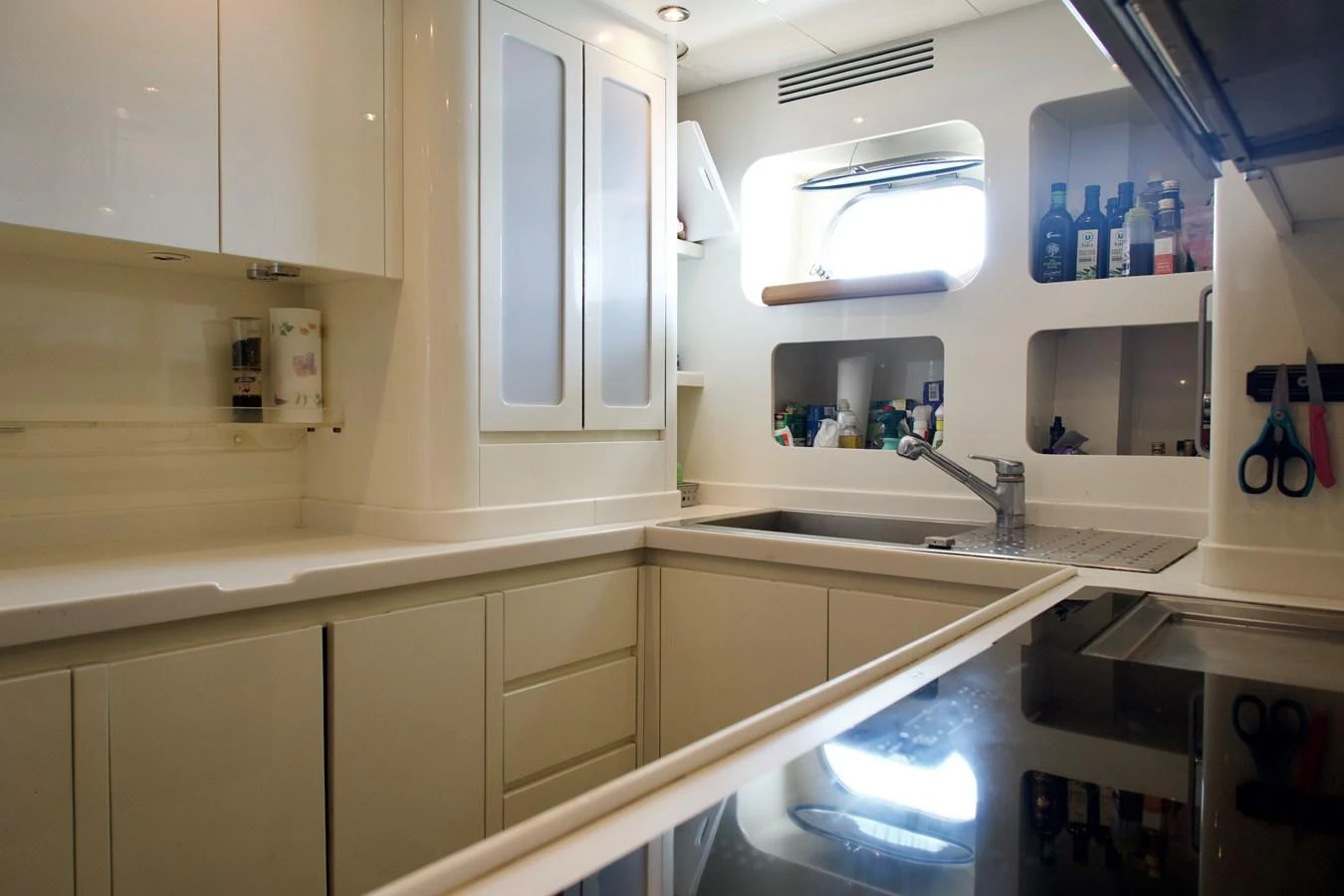The yacht's galley is equipped with modern appliances and ample storage, creating a functional and stylish cooking space. aboard CHEEKY TIGER Yacht for Sale