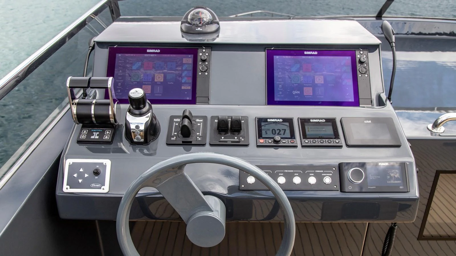 The helm station features advanced navigation equipment and a sleek, modern design. aboard MAVERICK Yacht for Sale