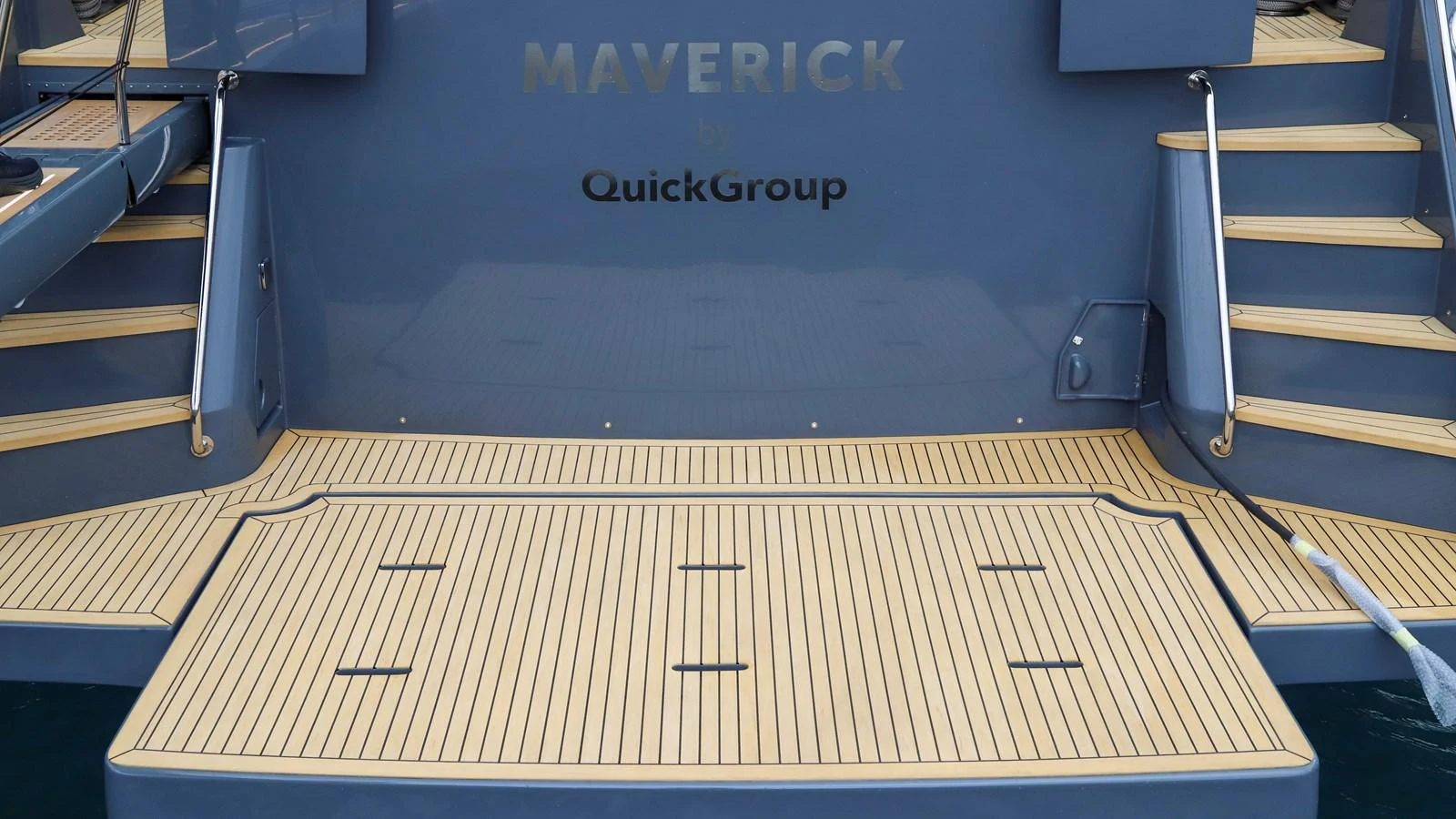 The yacht's stern features a spacious swim platform with elegant teak decking. aboard MAVERICK Yacht for Sale