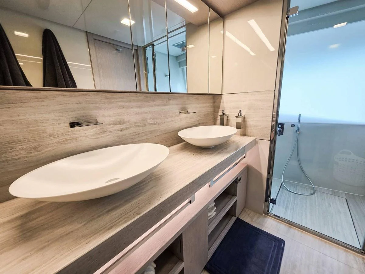 a bathroom with a sink and a mirror aboard CUSTOM LINE 108 Yacht for Sale