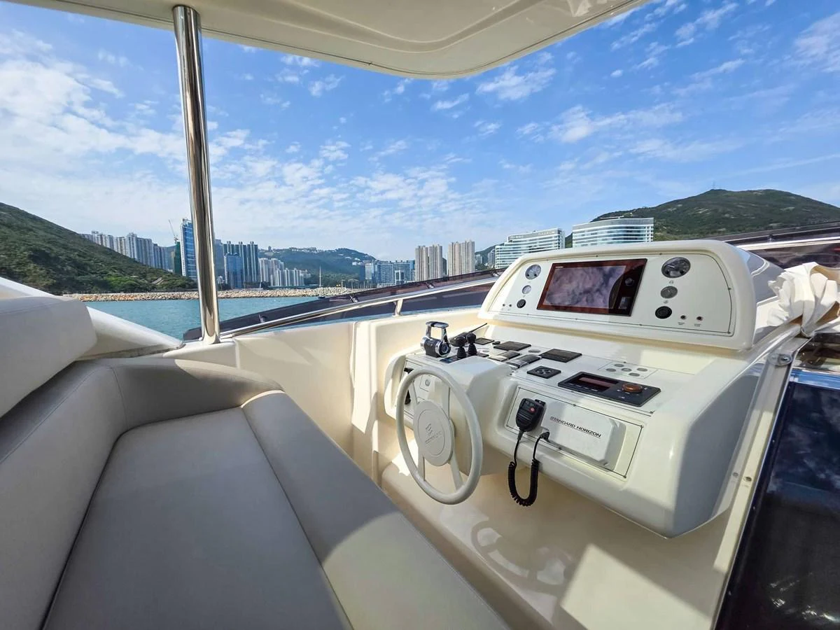a white car on a road aboard CUSTOM LINE 108 Yacht for Sale