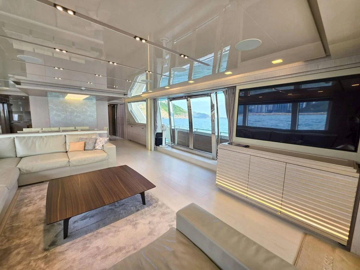 a living room with a large window aboard CUSTOM LINE 108 Yacht for Sale
