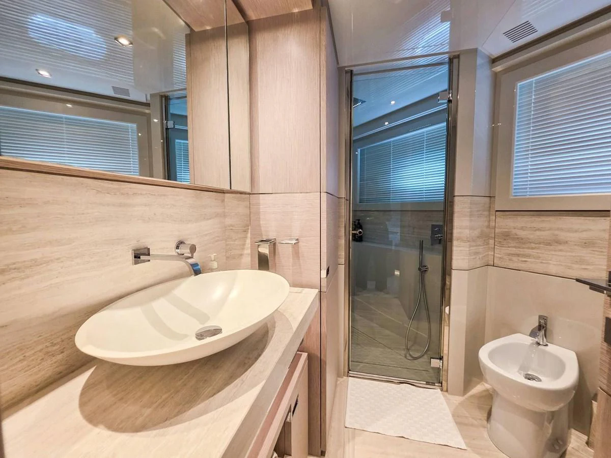 a bathroom with a sink and a toilet aboard CUSTOM LINE 108 Yacht for Sale