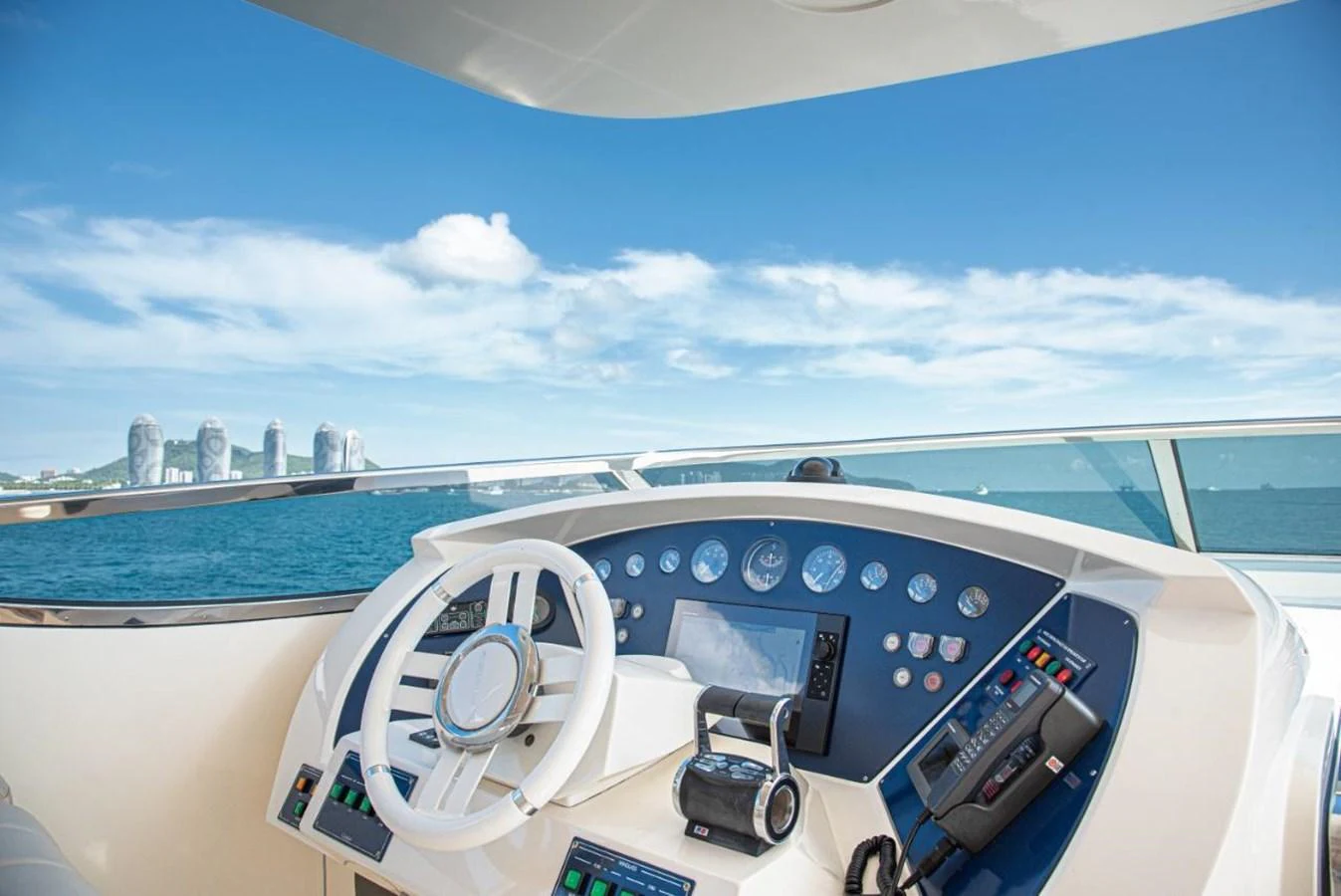The helm station offers a commanding view of the open sea with state-of-the-art navigation equipment. aboard AZIMUT 105 Yacht for Sale