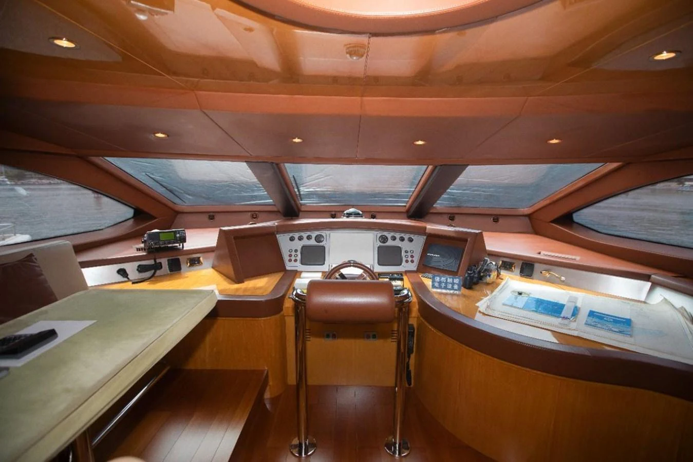 The helm station features a sophisticated control panel with panoramic windows for optimal visibility. aboard AZIMUT 105 Yacht for Sale
