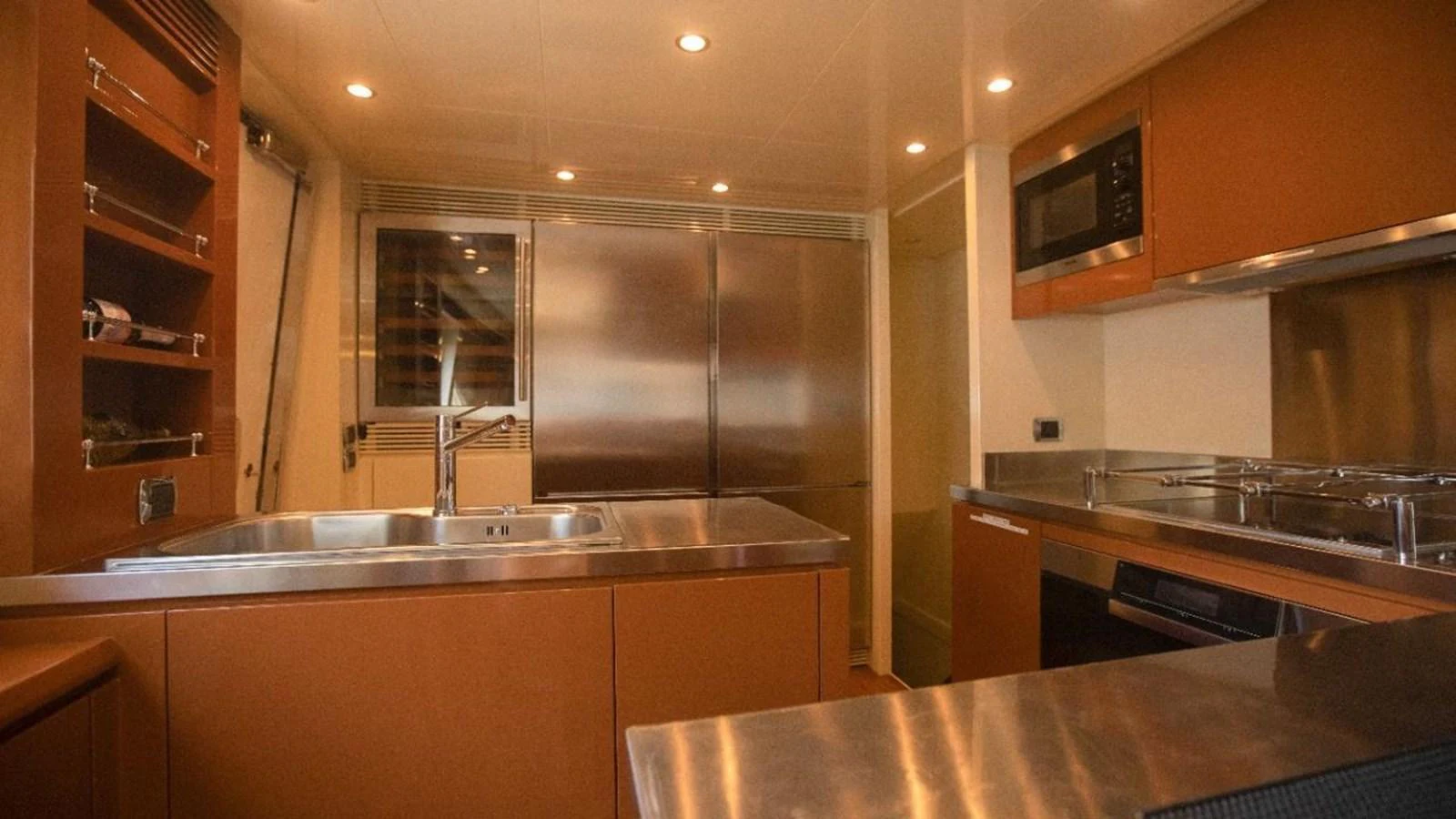 The yacht's galley features modern stainless steel appliances and ample storage space. aboard AZIMUT 105 Yacht for Sale