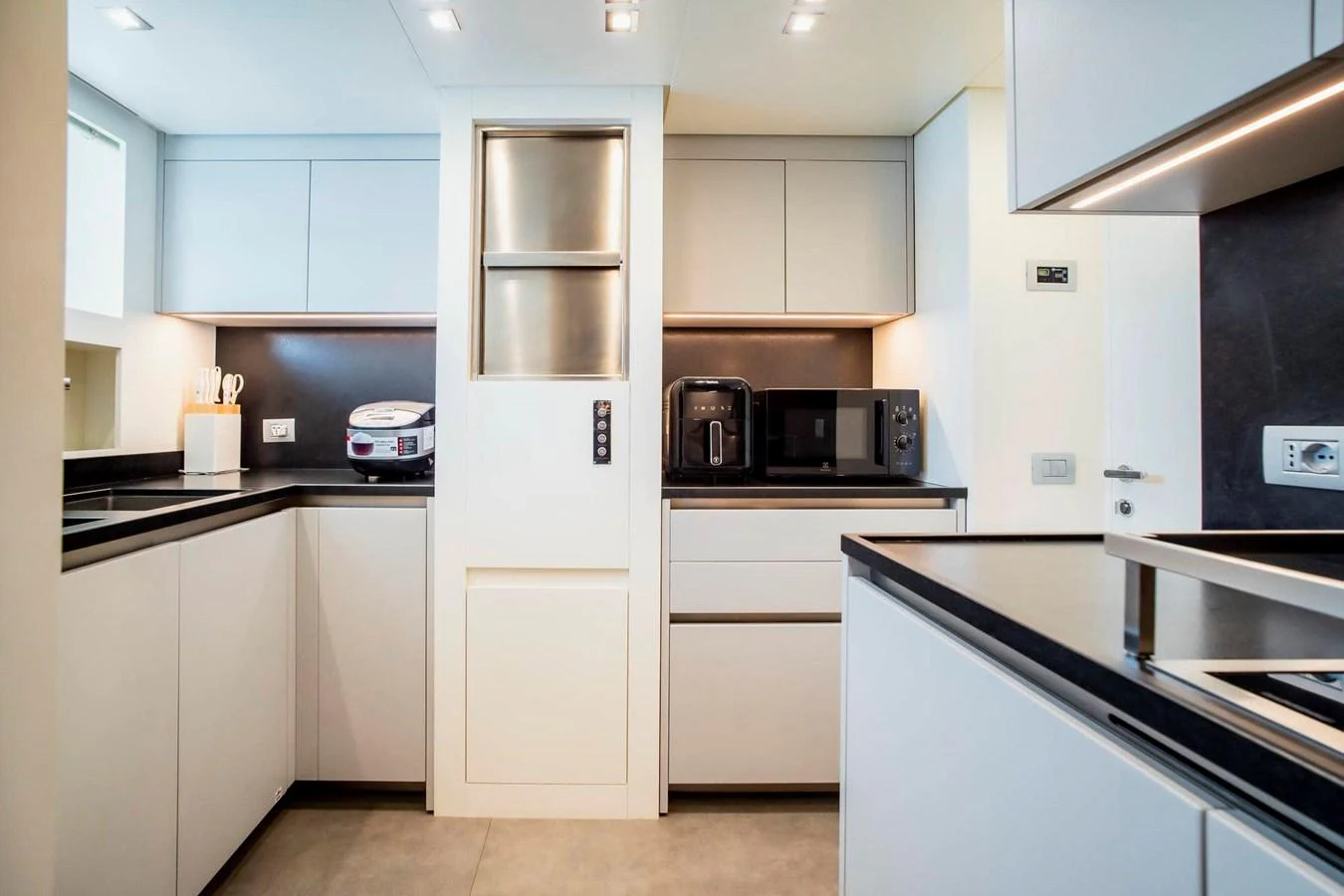 The galley features modern appliances and sleek cabinetry, creating a stylish and functional space for meal preparation. aboard SANLORENZO SX100 Yacht for Sale