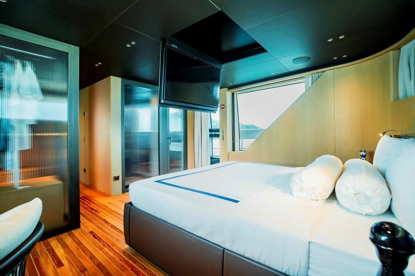 The master stateroom features a luxurious bed with modern decor and ample natural light. aboard SANLORENZO SX100 Yacht for Sale