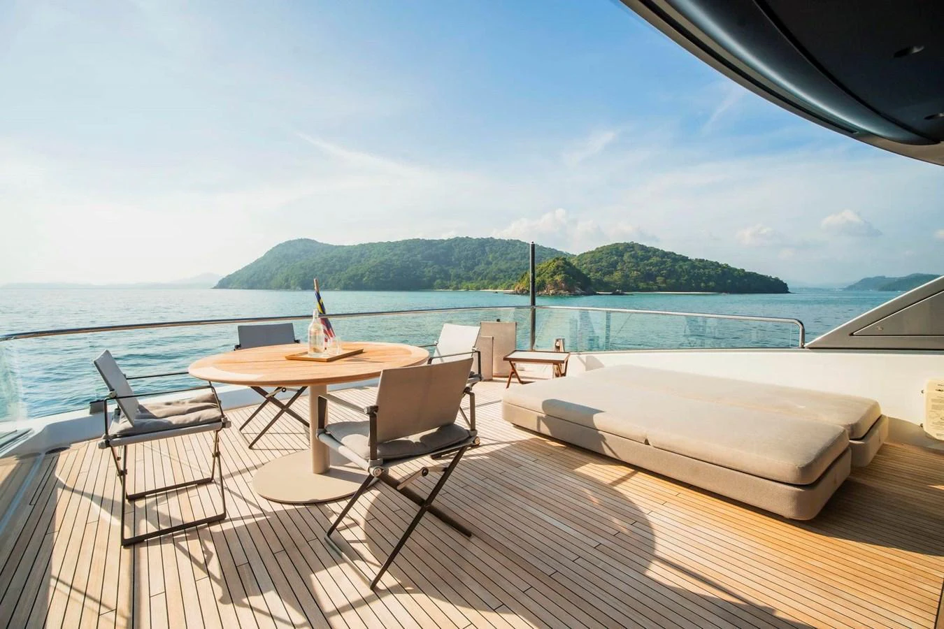 The aft deck offers a serene setting with comfortable seating and stunning views of the surrounding waters. aboard SANLORENZO SX100 Yacht for Sale