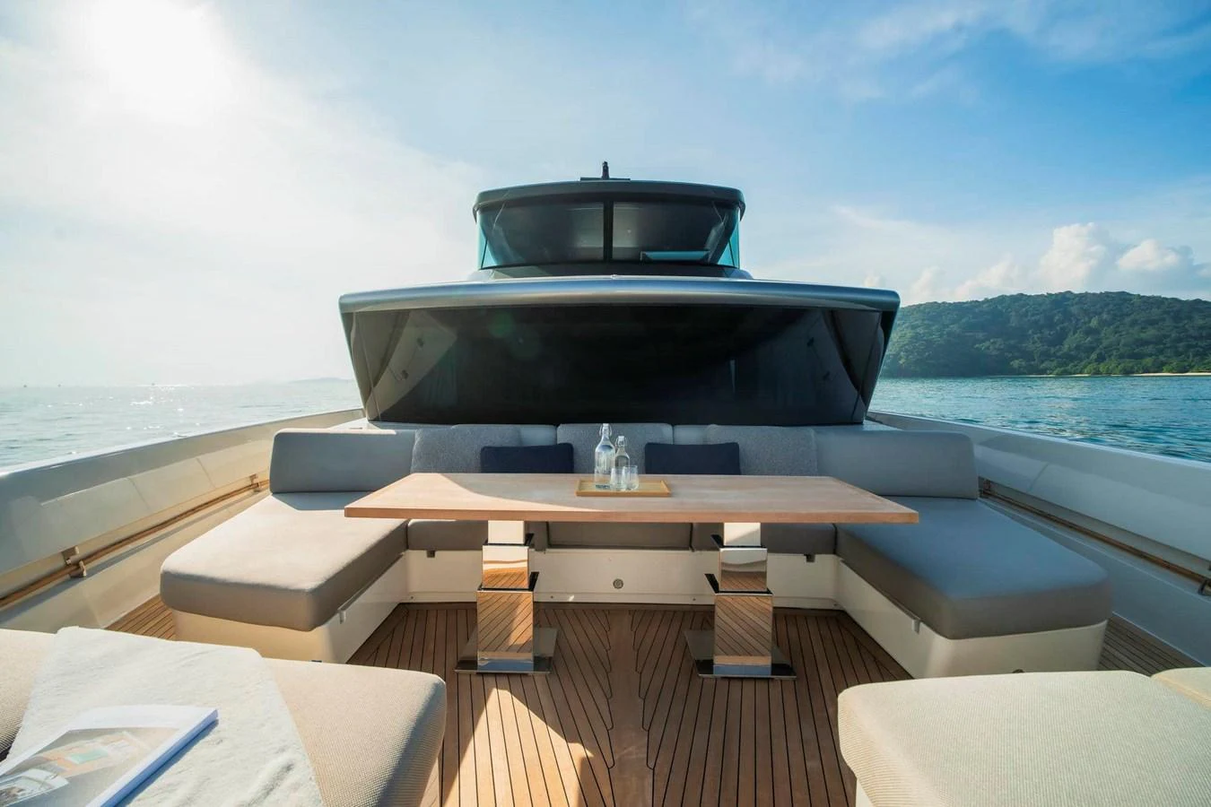 The aft deck features a spacious seating area with a central table, perfect for outdoor dining and relaxation. aboard SANLORENZO SX100 Yacht for Sale