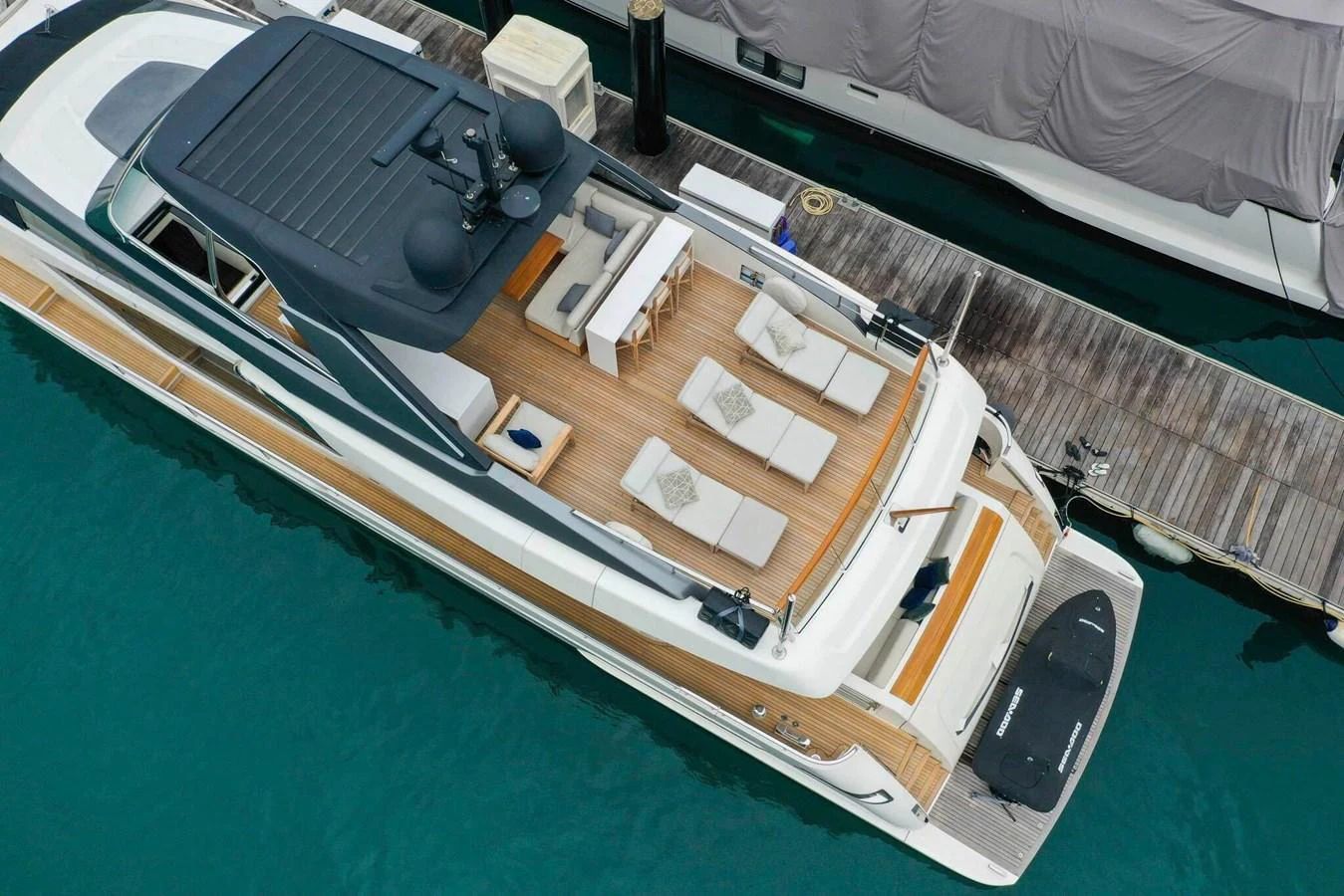 The yacht's aft deck features luxurious sun loungers and a sleek design, perfect for relaxation. aboard SANLORENZO SL86 Yacht for Sale