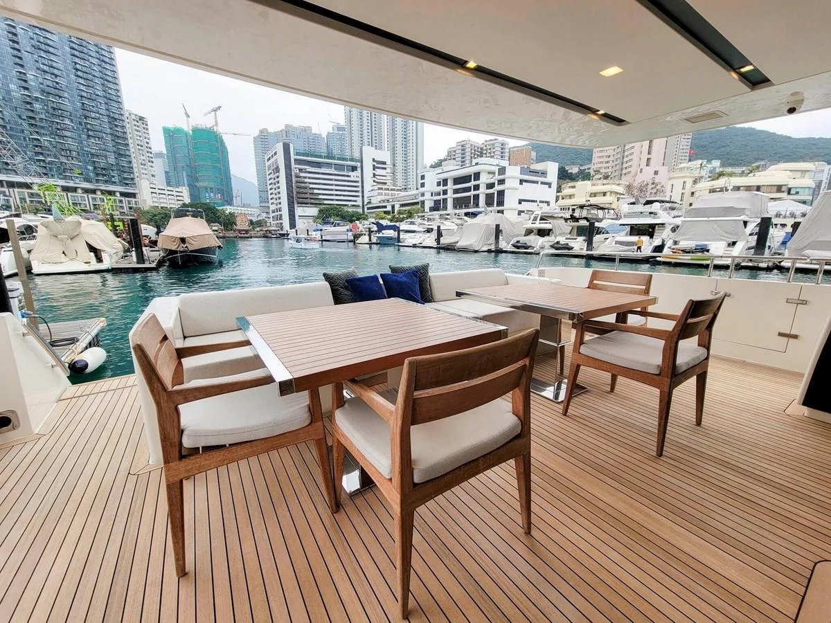 The aft deck offers a stylish and comfortable dining area with a view of the marina. aboard SANLORENZO SL86 Yacht for Sale