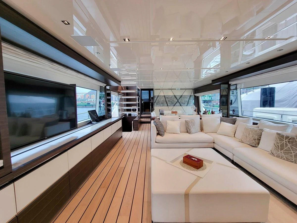 The spacious salon features a luxurious seating area with ample natural light and modern decor. aboard SANLORENZO SL86 Yacht for Sale