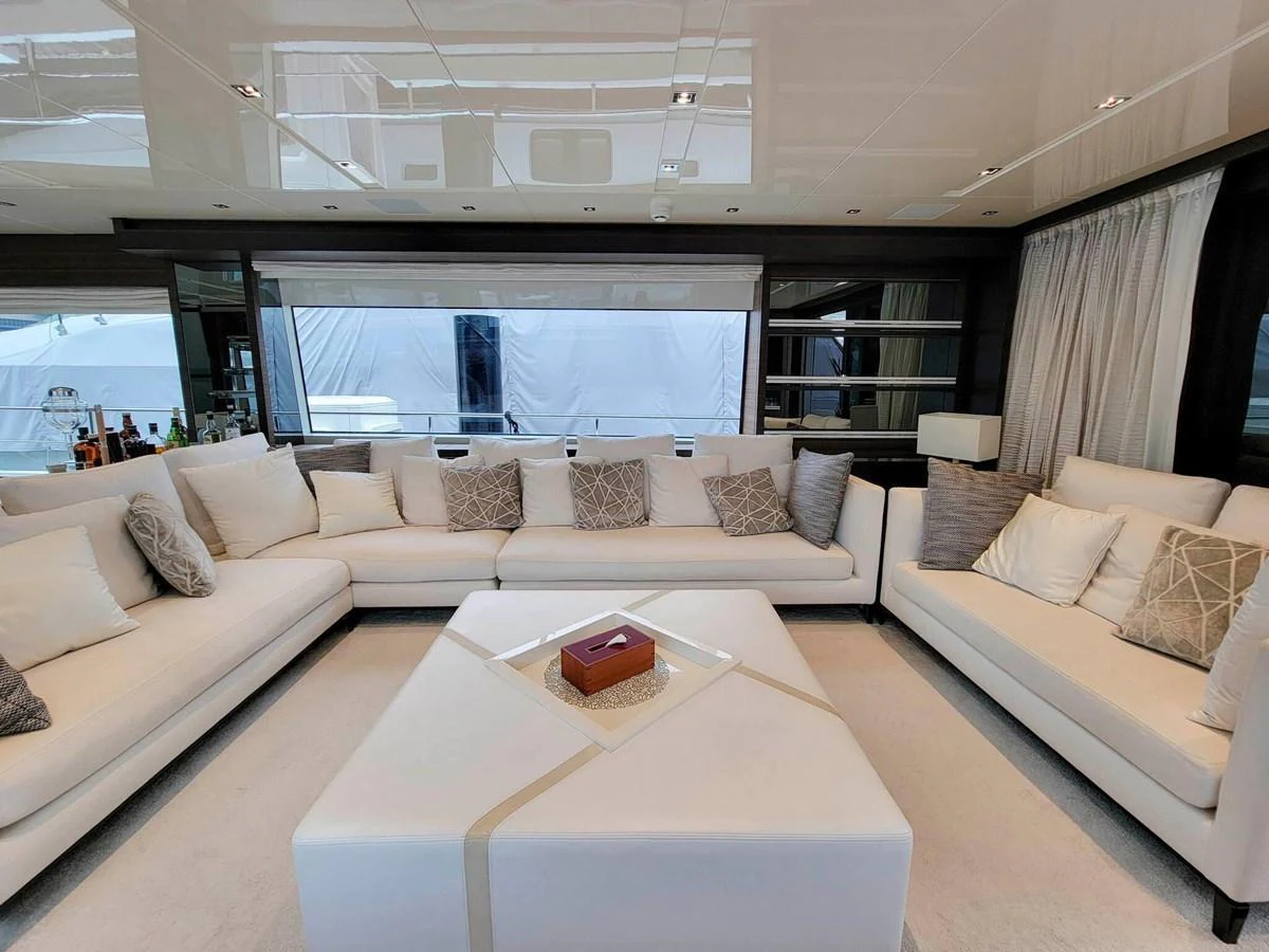 The salon features plush seating and a modern, elegant design. aboard SANLORENZO SL86 Yacht for Sale