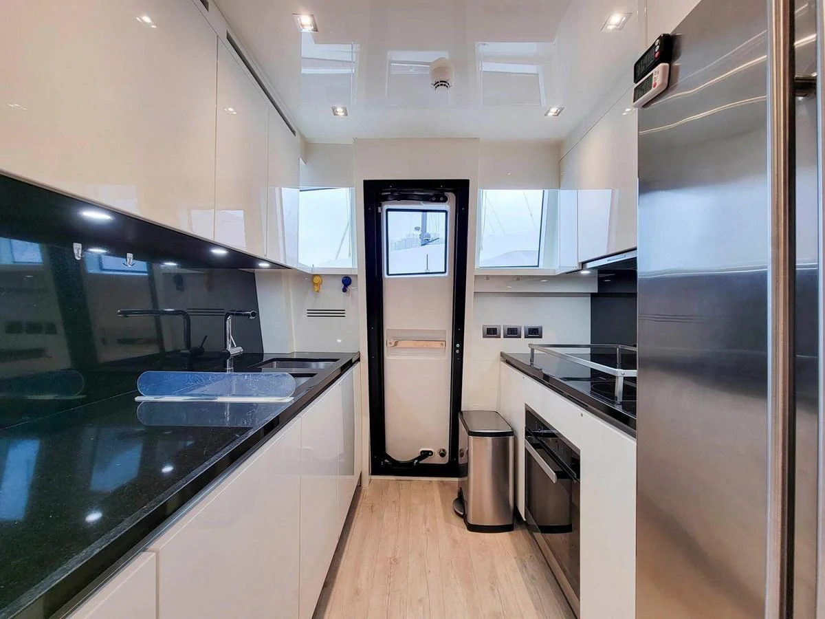 The modern galley features sleek appliances and ample counter space for gourmet meal preparation. aboard SANLORENZO SL86 Yacht for Sale
