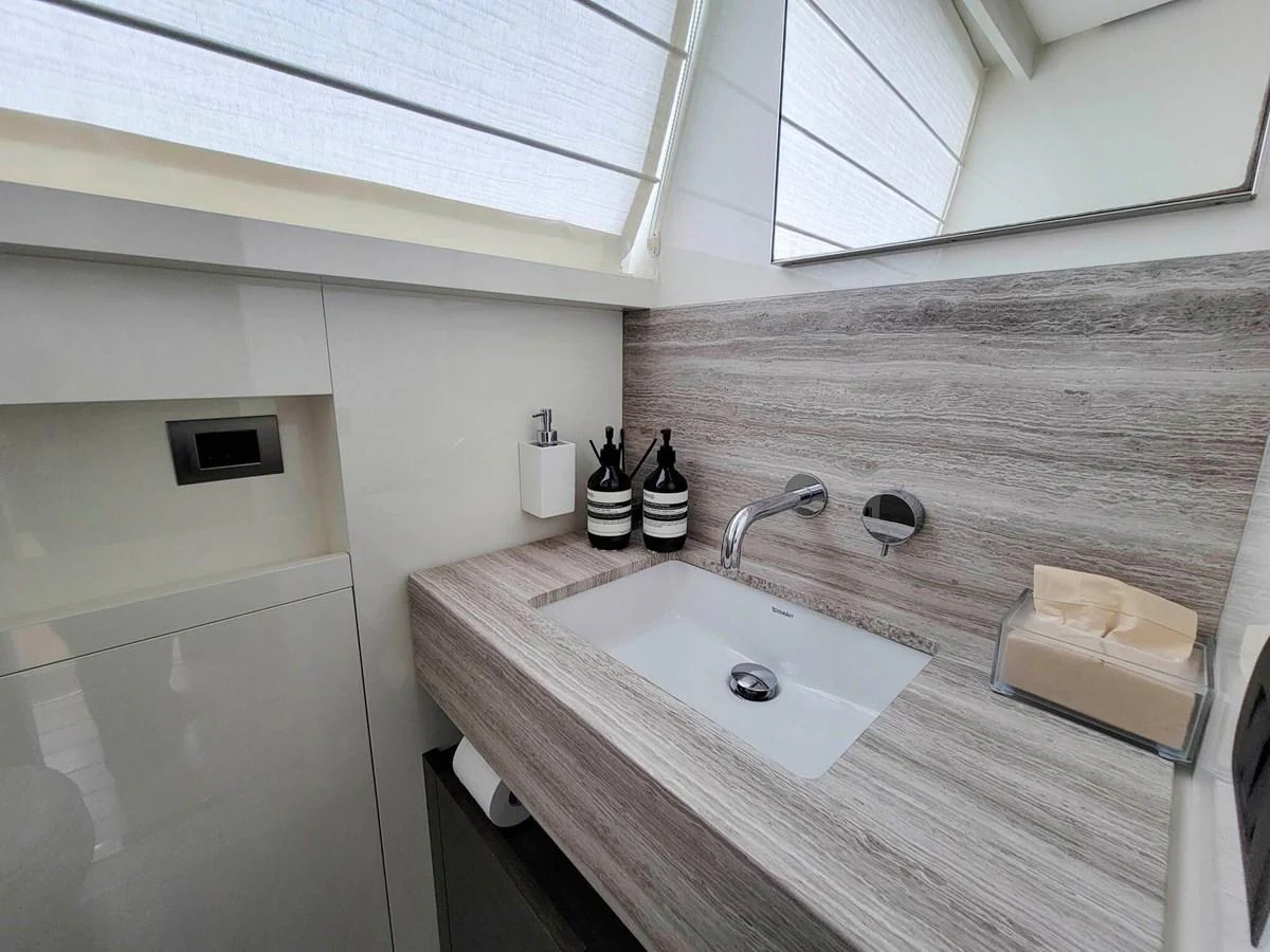 A modern and sleek bathroom with a minimalist design and high-end fixtures. aboard SANLORENZO SL86 Yacht for Sale