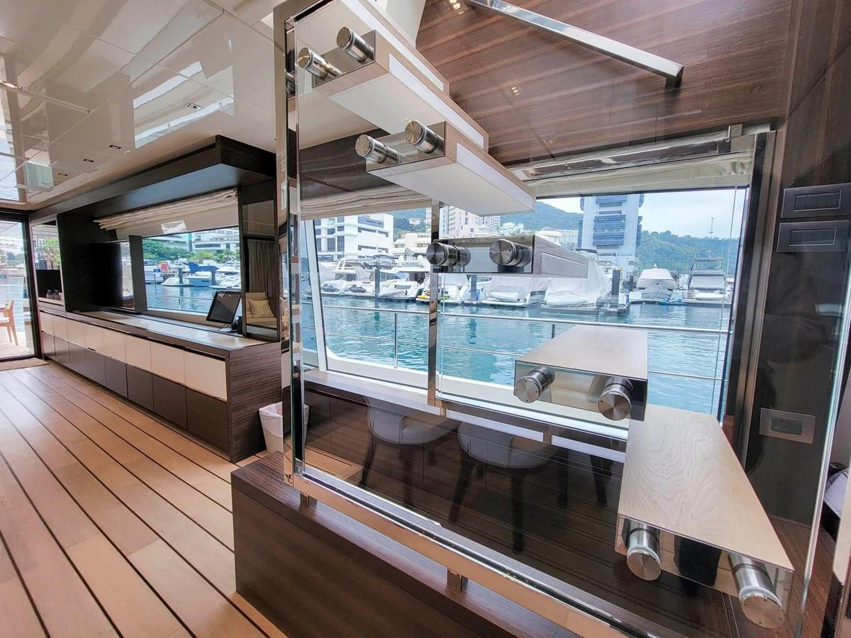 The galley features modern design elements with a view of the marina. aboard SANLORENZO SL86 Yacht for Sale