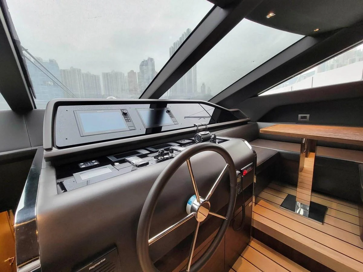 The yacht's helm features modern navigation equipment and a sleek design. aboard SANLORENZO SL86 Yacht for Sale