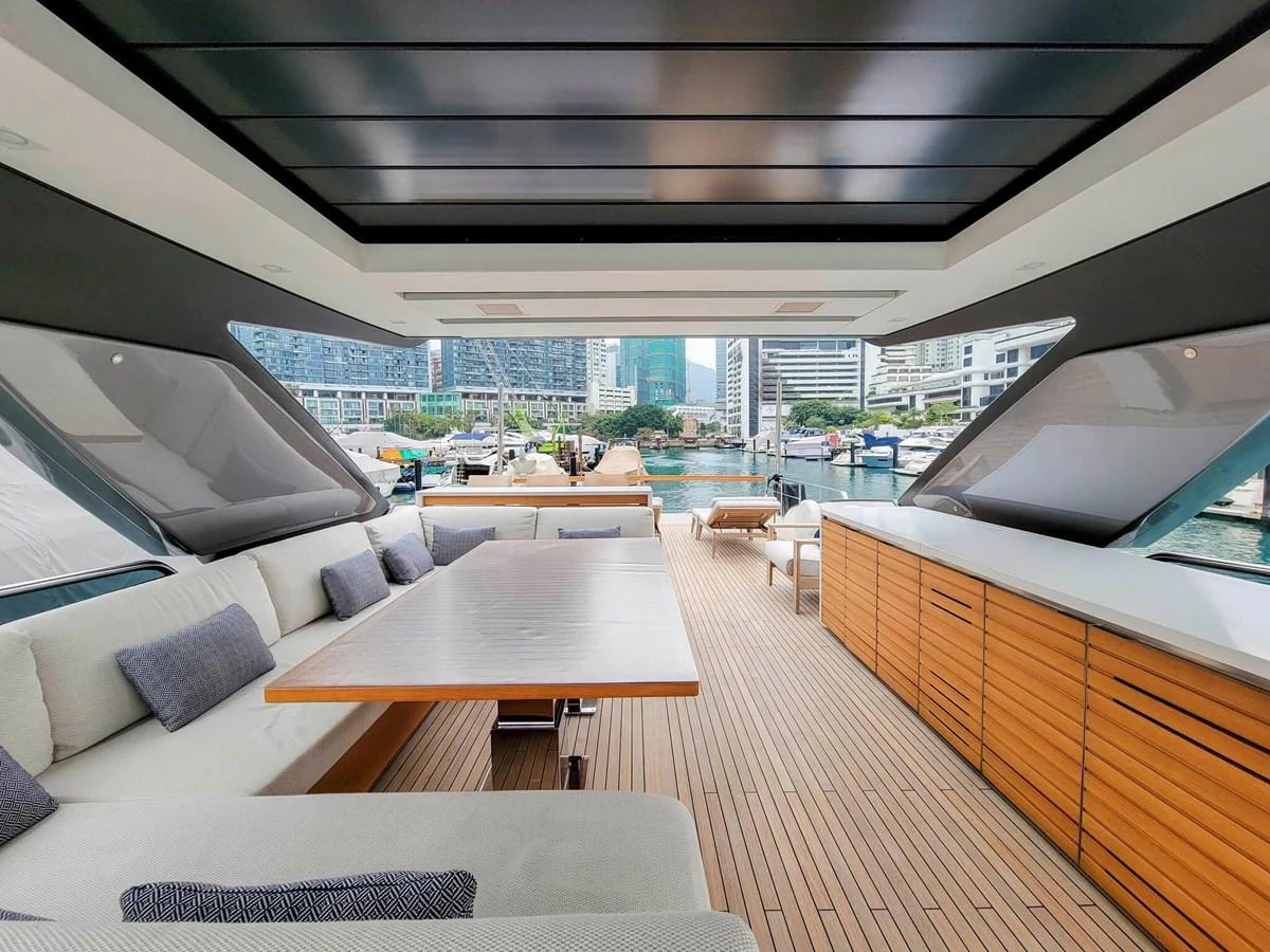 The aft deck features a spacious seating area with a large table and a sleek bar, perfect for entertaining. aboard SANLORENZO SL86 Yacht for Sale